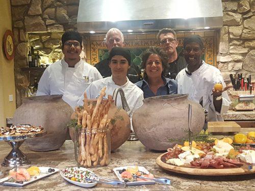 culinary arts students with platters of food