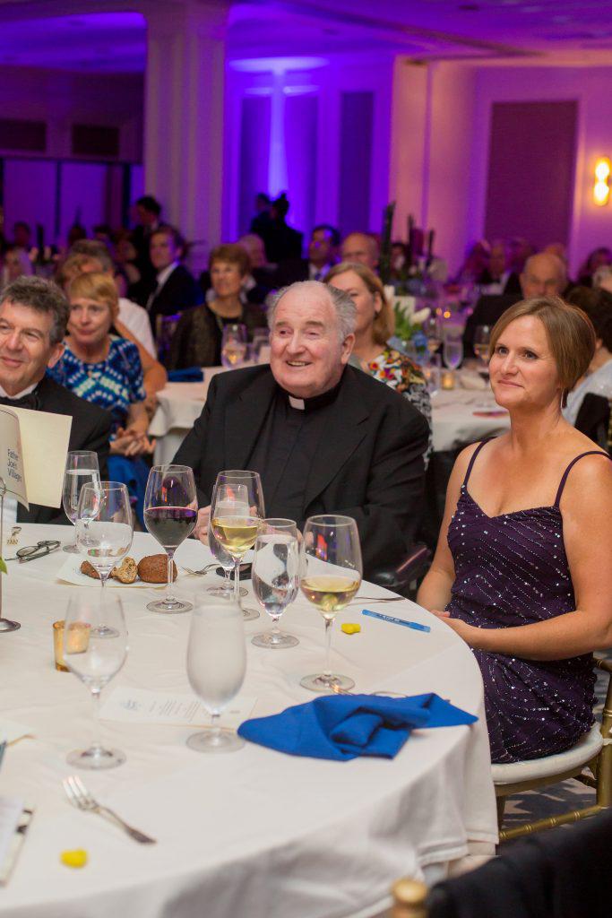 Father Joe Carroll received a standing ovation at the gala.