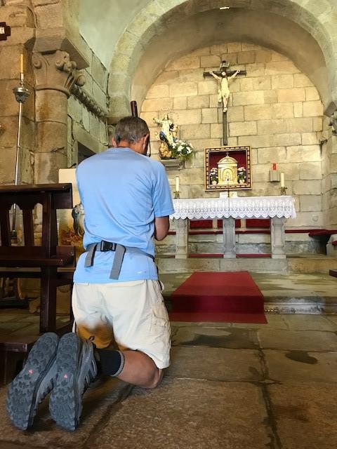 Deacon Jim Vargas prays at alter of St. Mary Magdalene
