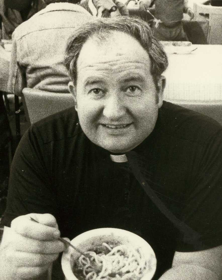 Younger Father Joe Carroll with a bowl of food
