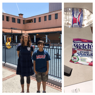 Kids Volunteer San Diego | Ishan stands next to Julie Dede, Communications Director in a courtyard during their tour of Father Joe's Villages. Next to that is Ishan's collection of items, including a water bottle, Welch's fruit snacks, a comb and a toothbrush.