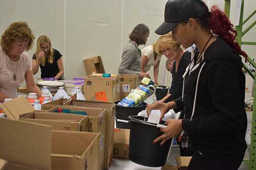 San Diego Downtown Breakfast Rotary Club Members filling Welcome Home Kits