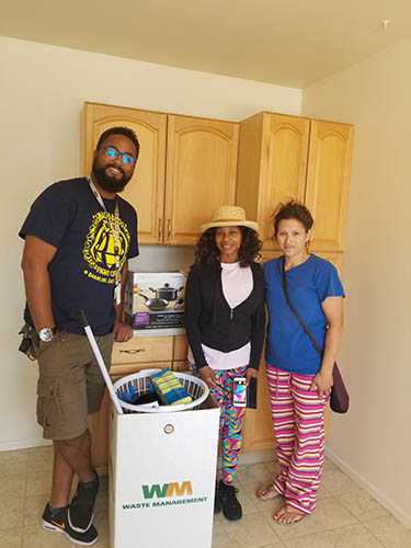 Landlord PartnershipsManny, a landlord and a client pose in the client's new home