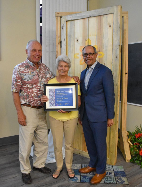 Gary & Betty Becker post with their certificate of appreciation with Deacon Jim Vargas. | Landlord Incentives Program