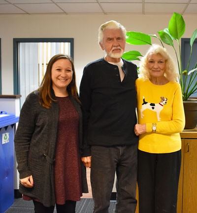 Charlotte and Merv stand with Colleen, the Donor Database Analyst at Father Joe's Villages. | volunteer work, volunteer opportunities
