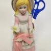 Porcelain Sewing Girl Figurine
